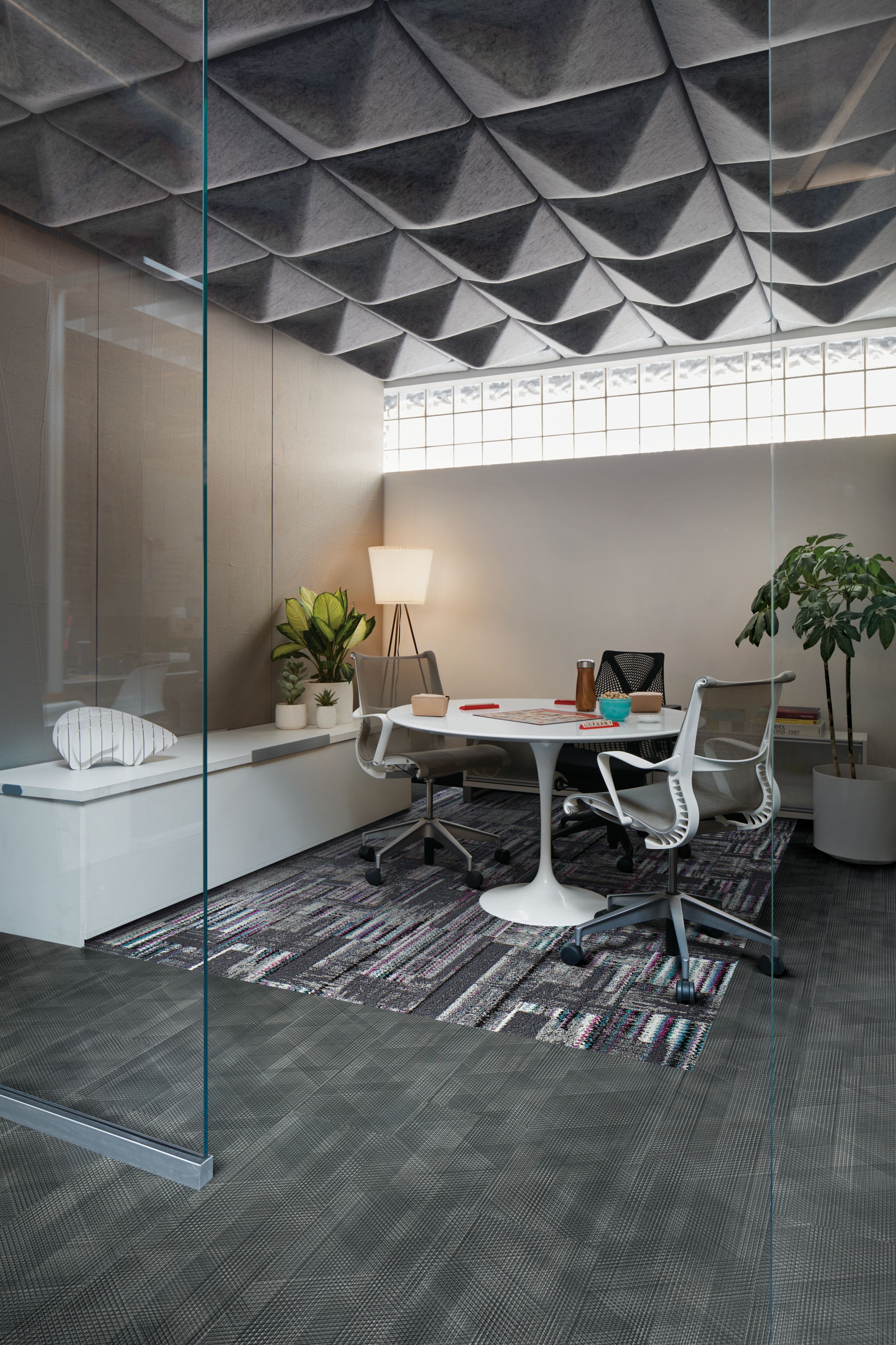 Interface Hard Drive plank carpet tile and Drawn Lines LVT in focus room with glass doorway and lamp in background image number 2